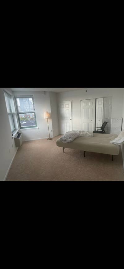 Furnished master bedroom with attached bathroom Main Photo