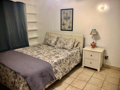 Furnished Bedroom w En_Suite Bathroom~UtilsPkg Main Photo