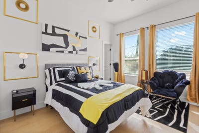 Luxury 3BR Gated Oasis_Bedroom _ Shared Bath Main Photo