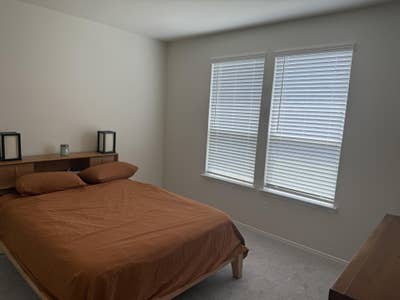 Master bedroom and bath in Sunfield Main Photo