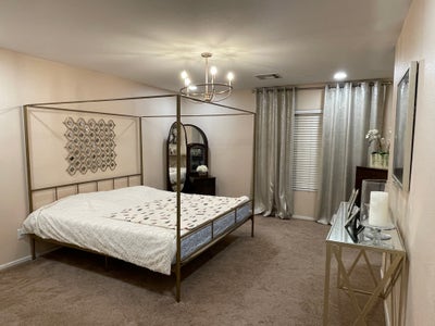 Master bedroom with king-size bed and private bath Main Photo