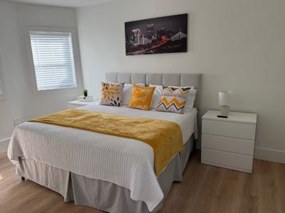 The room is furnished with two cozy twin beds, a w Main Photo