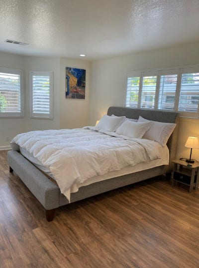 The bedroom offers a comfortable king-size bed and Main Photo